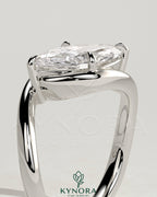 Kynora CJ 2ct marquise east-west claw solitaire engagement ring with bypass band showcasing a sparkling marquise-shaped diamond.