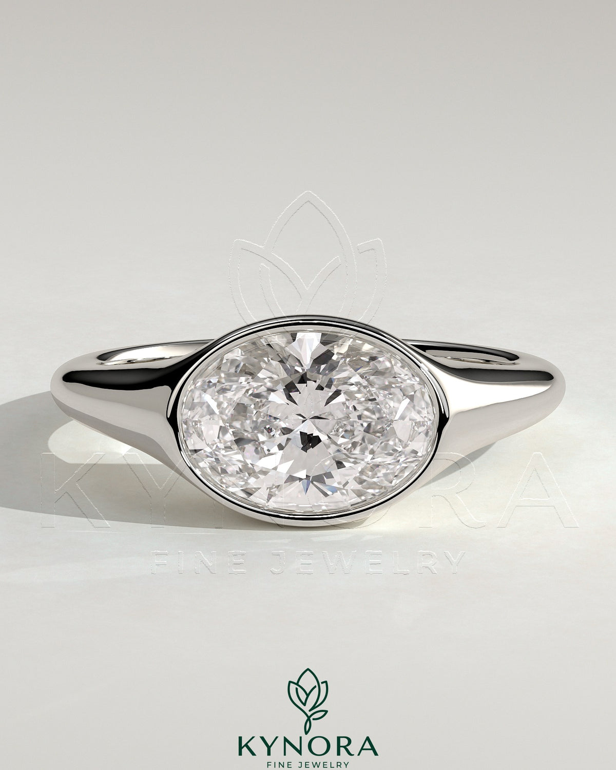 Kynora CJ 2ct oval east-west bezel solitaire engagement ring with signet band, featuring a central diamond and sleek gold design.