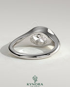 Kynora CJ 2ct oval east-west bezel solitaire engagement ring with signet band showcasing a sparkling central gemstone and elegant design.