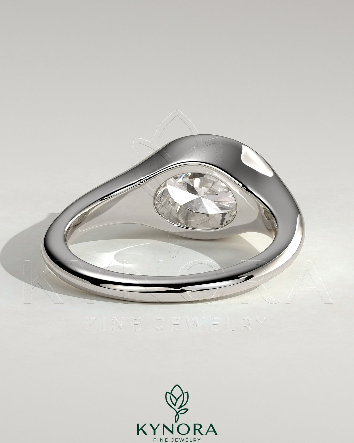 Kynora CJ 2ct oval east-west bezel solitaire engagement ring with signet band showcasing a sparkling central gemstone and elegant design.