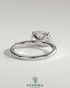 Kynora CJ 2ct oval east-west claw solitaire engagement ring with four prongs, showcasing a sparkling center stone and elegant setting.
