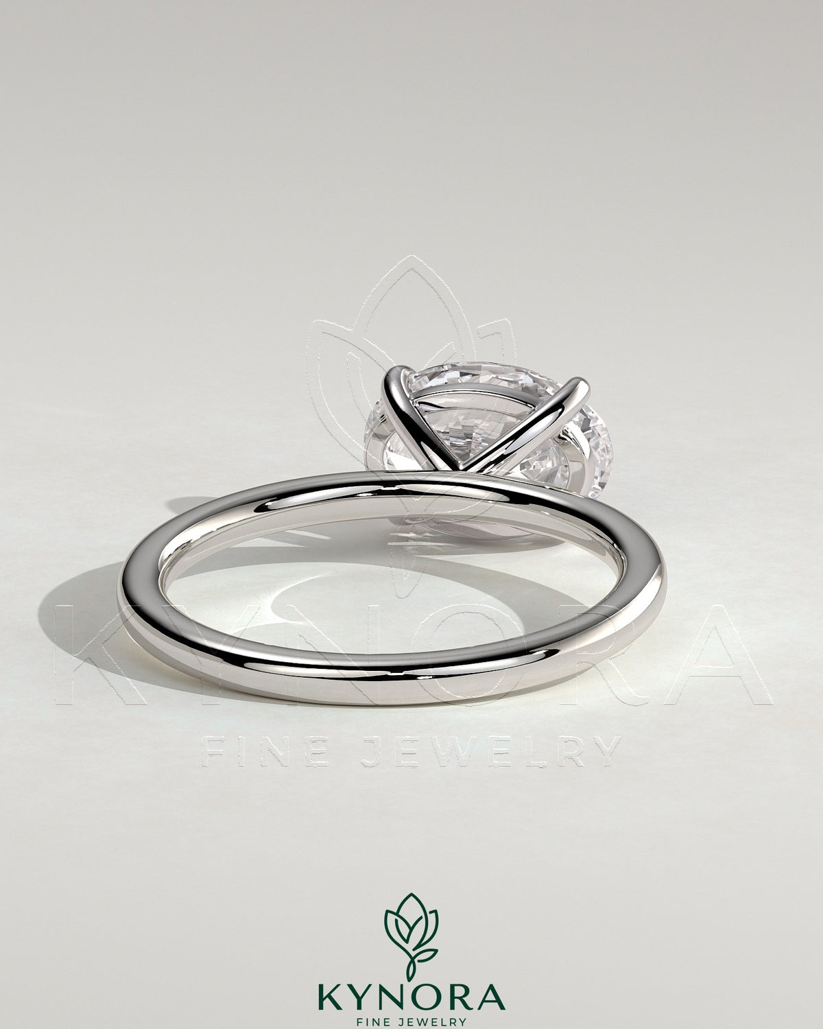 Kynora CJ 2ct oval east-west claw solitaire engagement ring with four prongs, showcasing a sparkling center stone and elegant setting.