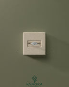 Kynora CJ 2ct oval East-West claw solitaire engagement ring with four prongs, featuring a sparkling center stone in a sleek design.