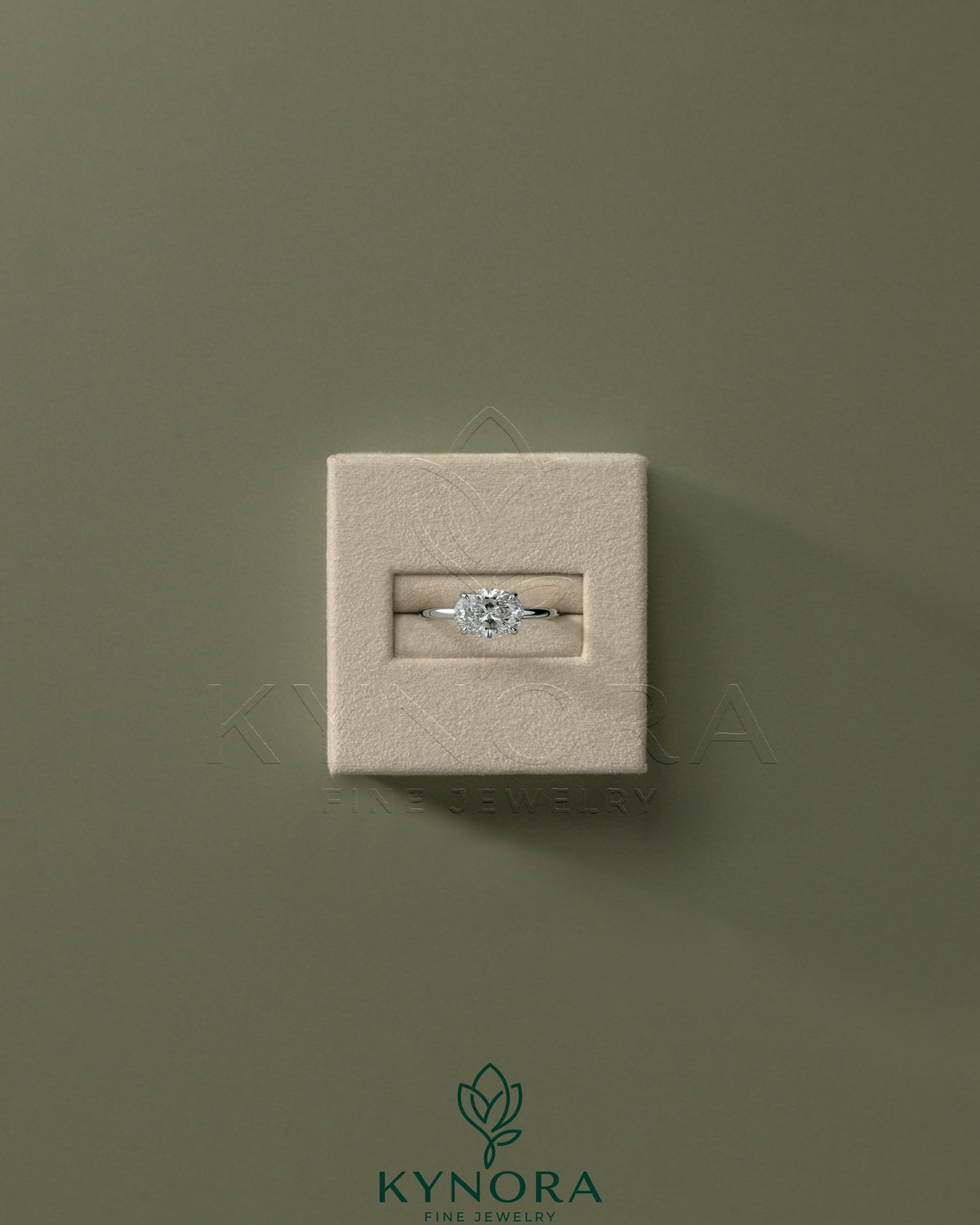 Kynora CJ 2ct oval East-West claw solitaire engagement ring with four prongs, featuring a sparkling center stone in a sleek design.