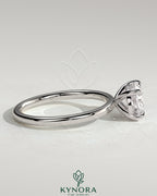 Kynora CJ 2ct oval east-west claw solitaire engagement ring with four prongs, showcasing a sparkling oval diamond setting.