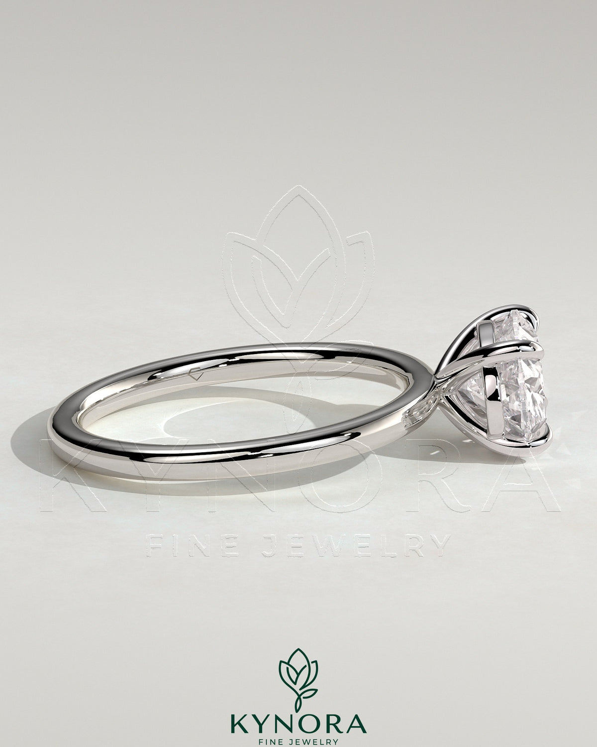 Kynora CJ 2ct oval east-west claw solitaire engagement ring with four prongs, showcasing a sparkling oval diamond setting.