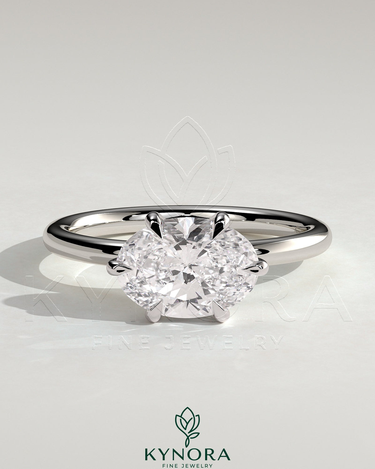 Kynora CJ 2ct oval east-west claw solitaire engagement ring with six prongs featuring a sparkling gemstone setting. Imagen principal del producto