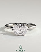 Kynora CJ 2ct oval east-west claw solitaire engagement ring with six prongs featuring a sparkling gemstone setting.