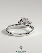 Kynora CJ 2ct oval east-west claw solitaire engagement ring with six prongs, showcasing a sparkling central diamond.