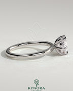 Kynora CJ 2ct oval east-west claw solitaire engagement ring with six prongs, showcasing a sparkling center stone on a sleek band.