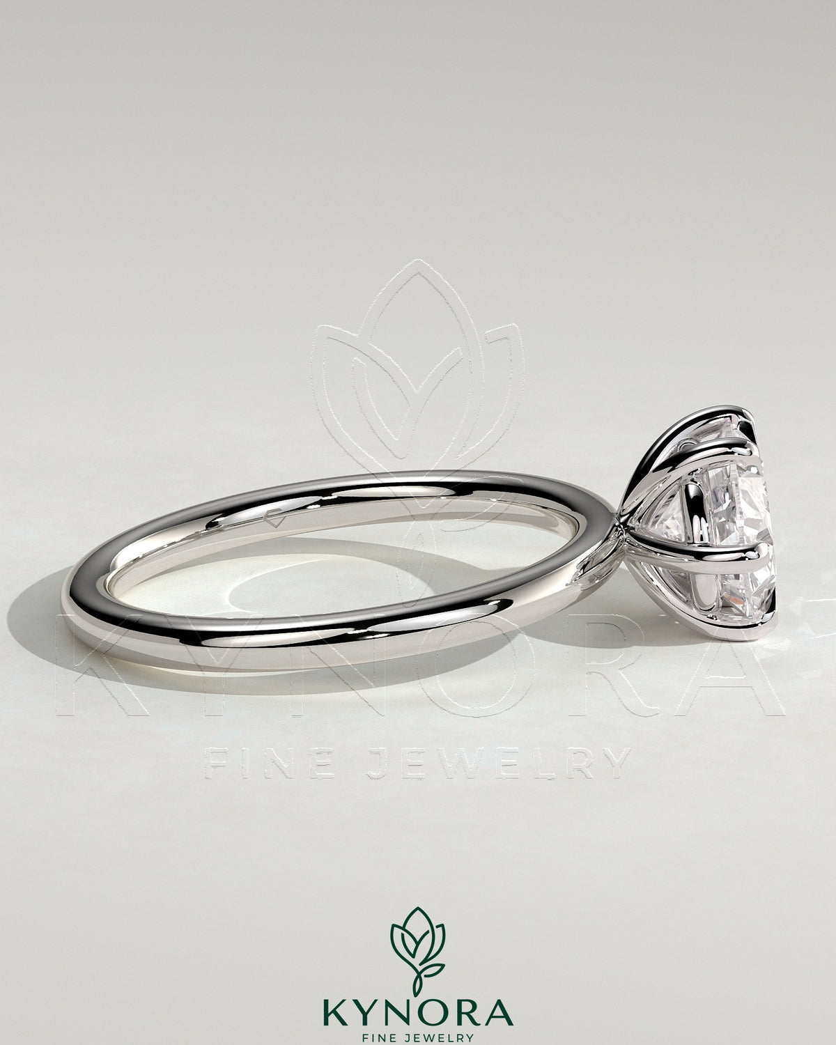 Kynora CJ 2ct oval east-west claw solitaire engagement ring with six prongs, showcasing a sparkling center stone on a sleek band.