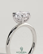 Kynora CJ 2ct oval east-west claw solitaire engagement ring with six prongs, showcasing a sparkling central diamond.