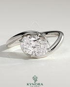 Kynora CJ 2ct oval East-West claw solitaire engagement ring with bypass band, showcasing a sparkling oval diamond and elegant design.