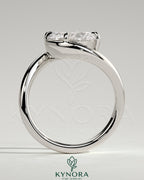 Kynora CJ 2ct oval East-West claw solitaire engagement ring with bypass band, featuring a sparkling central diamond.