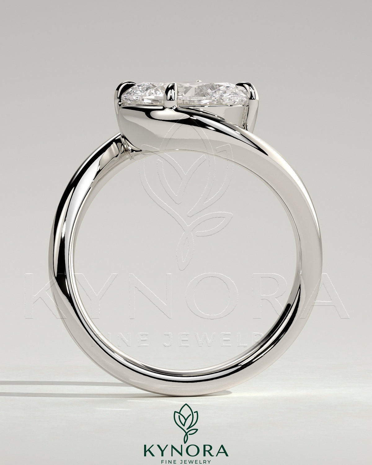 Kynora CJ 2ct oval East-West claw solitaire engagement ring with bypass band, featuring a sparkling central diamond.