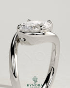 Oval 2ct East-West Claw Solitaire engagement ring with bypass band by Kynora CJ, featuring a prominent oval diamond and elegant design.
