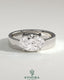 Kynora CJ 2ct oval offset east-west claw solitaire engagement ring with flat cigar band, showcasing a sparkling diamond setting.