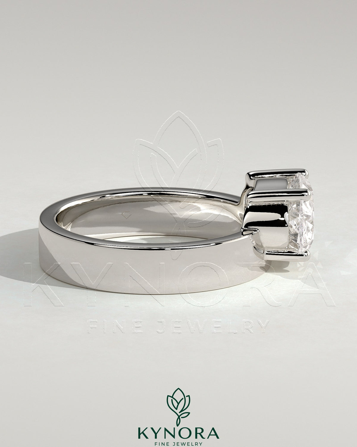 Kynora CJ 2ct oval offset east-west claw solitaire engagement ring with flat cigar band in gold.