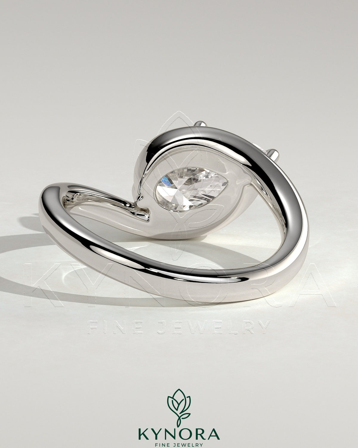 Kynora CJ 2ct pear-shaped east-west claw solitaire engagement ring with bypass band featuring a sparkling diamond.