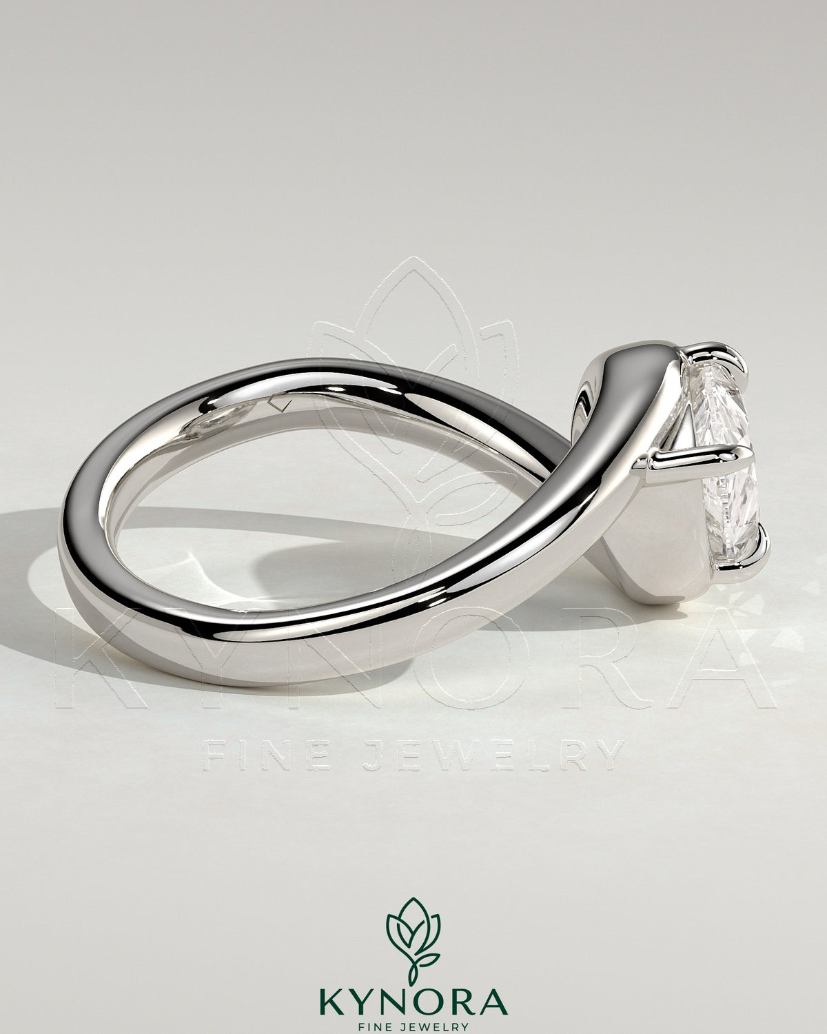 Kynora CJ 2ct pear-shaped east-west diamond solitaire engagement ring with bypass band in gold, showcasing intricate design details.