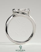 Kynora CJ 2ct Pear-shaped East-West Claw Solitaire engagement ring with bypass band, featuring a sparkling pear cut diamond.