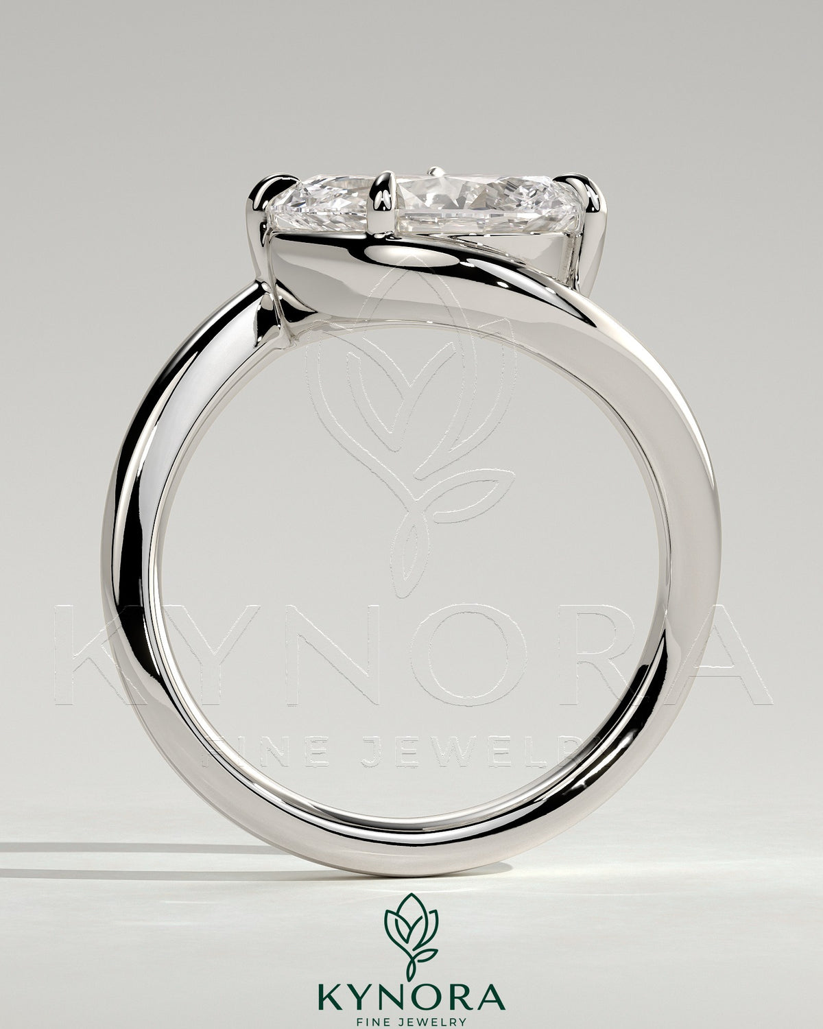 Kynora CJ 2ct Pear-shaped East-West Claw Solitaire engagement ring with bypass band, featuring a sparkling pear cut diamond.