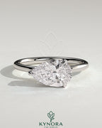 Kynora CJ 2-carat pear-shaped east-west claw solitaire engagement ring with hidden halo and elegant design.