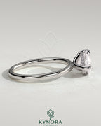 Kynora CJ 2ct pear-shaped East-West claw engagement ring with hidden halo and sparkling diamond accents.