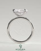 Kynora CJ 2ct pear-shaped east-west claw solitaire engagement ring with hidden halo and sparkling diamond accents.