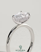 Kynora CJ 2ct pear-shaped east-west claw solitaire engagement ring with hidden halo and intricate diamond setting.