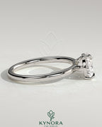 Kynora CJ 2-carat pear-shaped east-west claw solitaire engagement ring with raised basket gallery setting showcasing the diamond.