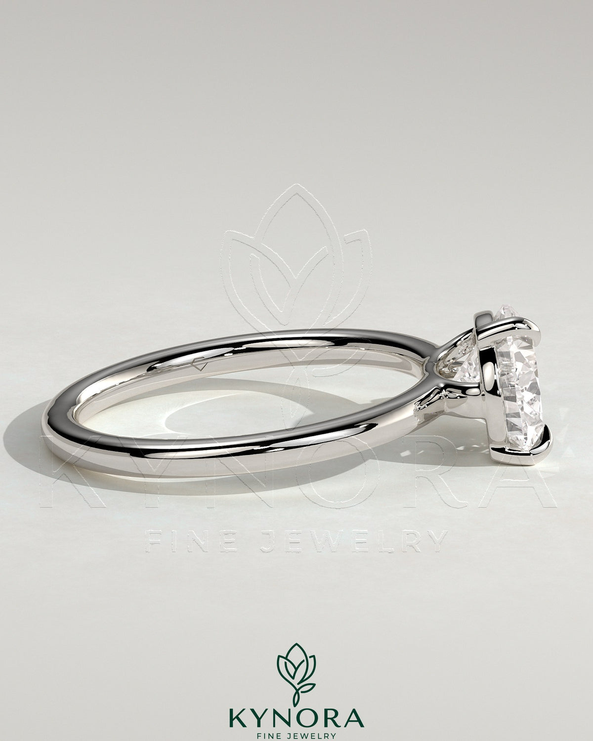 Kynora CJ 2-carat pear-shaped east-west claw solitaire engagement ring with raised basket gallery setting showcasing the diamond.