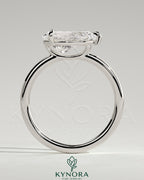Kynora CJ 2ct pear-shaped east-west claw solitaire engagement ring with raised basket gallery in silver or gold metal.