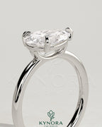 Kynora CJ 2ct pear-shaped east-west claw solitaire engagement ring with raised basket gallery in sterling silver.