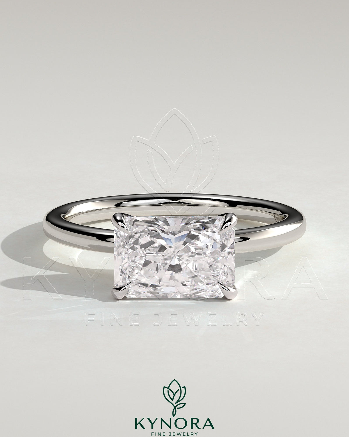 Kynora CJ 2ct radiant east-west claw solitaire engagement ring with a central diamond set horizontally on a sleek band. Imagen principal del producto
