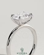 Kynora CJ 2ct radiant east-west claw solitaire engagement ring with a bright diamond set horizontally on a sleek band.