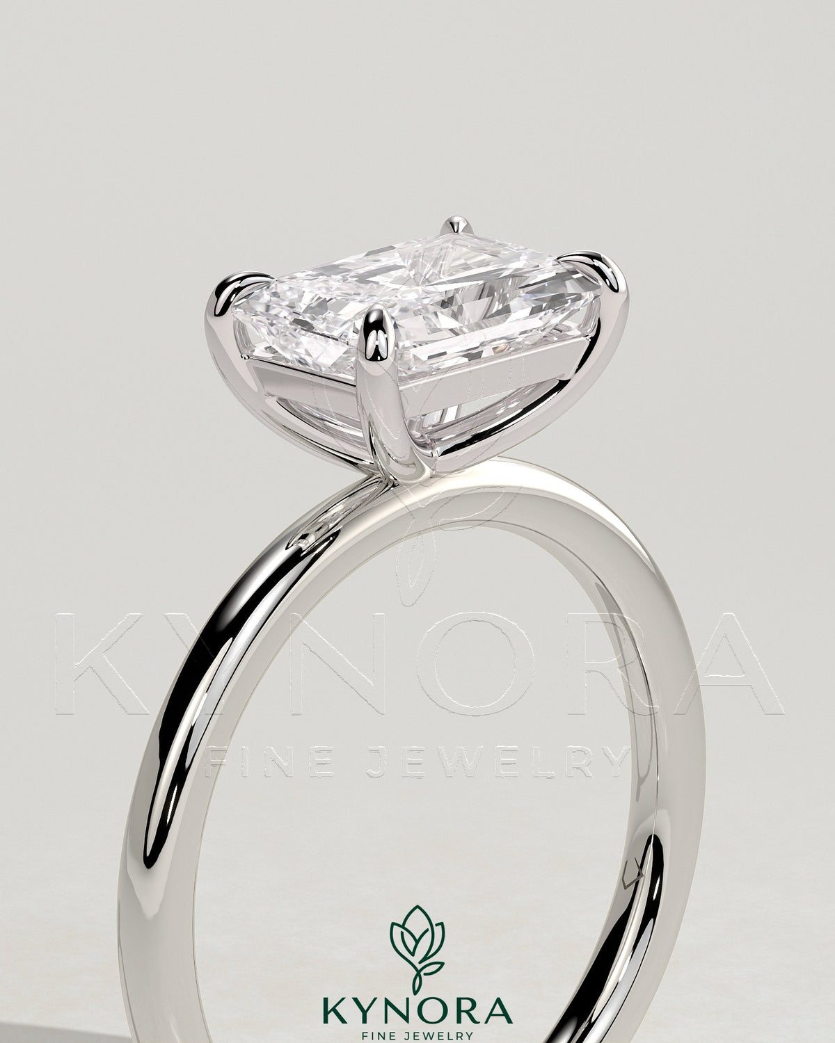 Kynora CJ 2ct radiant east-west claw solitaire engagement ring with a bright diamond set horizontally on a sleek band.