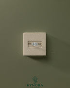 Kynora CJ 2ct radiant east-west claw solitaire engagement ring with a sparkling diamond setting on a sleek band