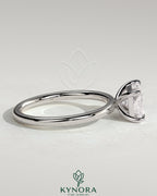 Kynora CJ 2ct radiant cut East-West claw solitaire engagement ring showcasing a sparkling diamond setting.