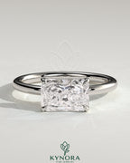 Kynora CJ 2ct radiant east-west claw solitaire engagement ring with raised basket gallery in elegant jewelry setting