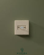 Kynora CJ 2ct radiant east-west claw solitaire engagement ring with raised basket gallery design and sparkling diamond.