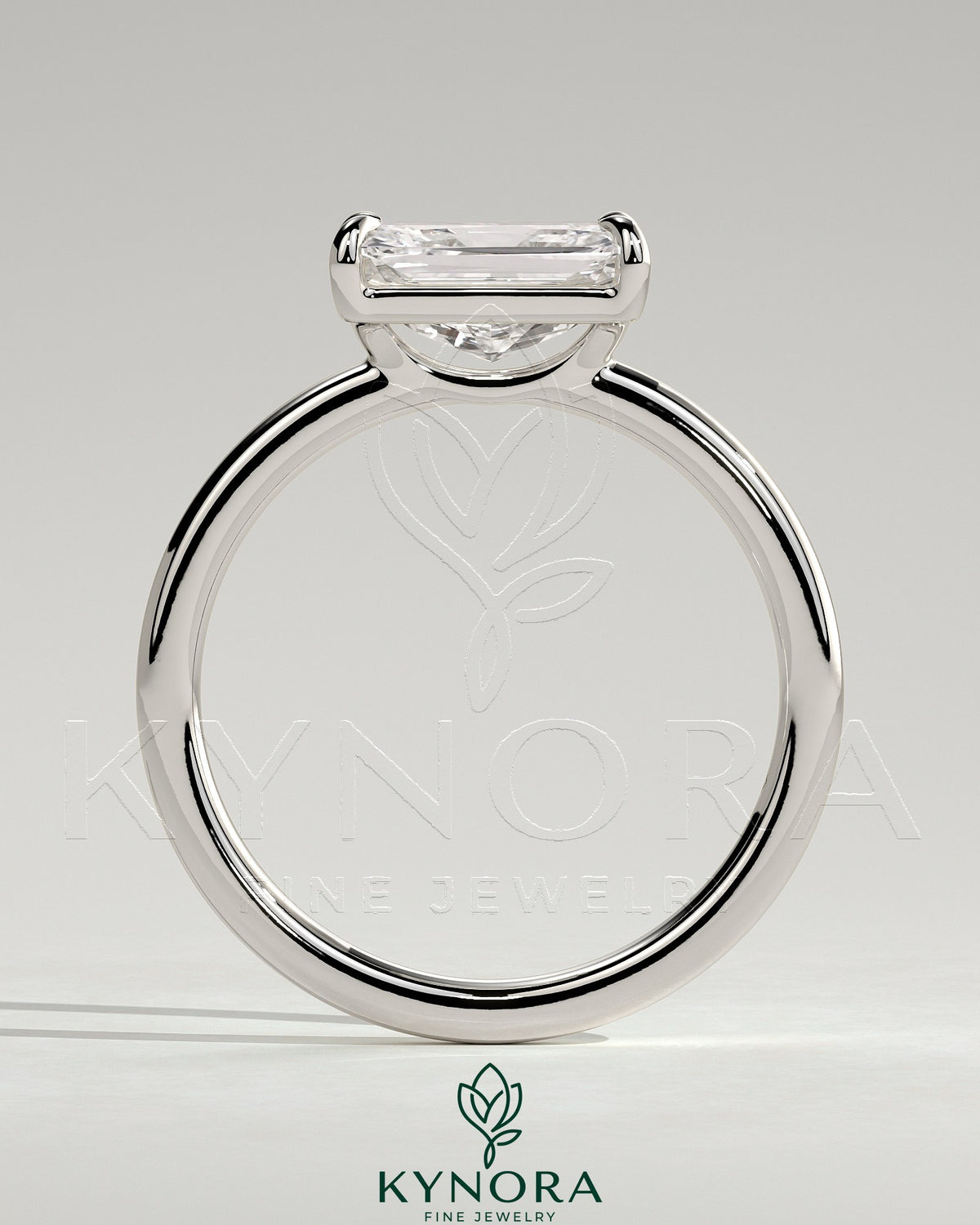 Kynora CJ 2ct radiant east-west claw solitaire engagement ring with raised basket gallery and elegant design.