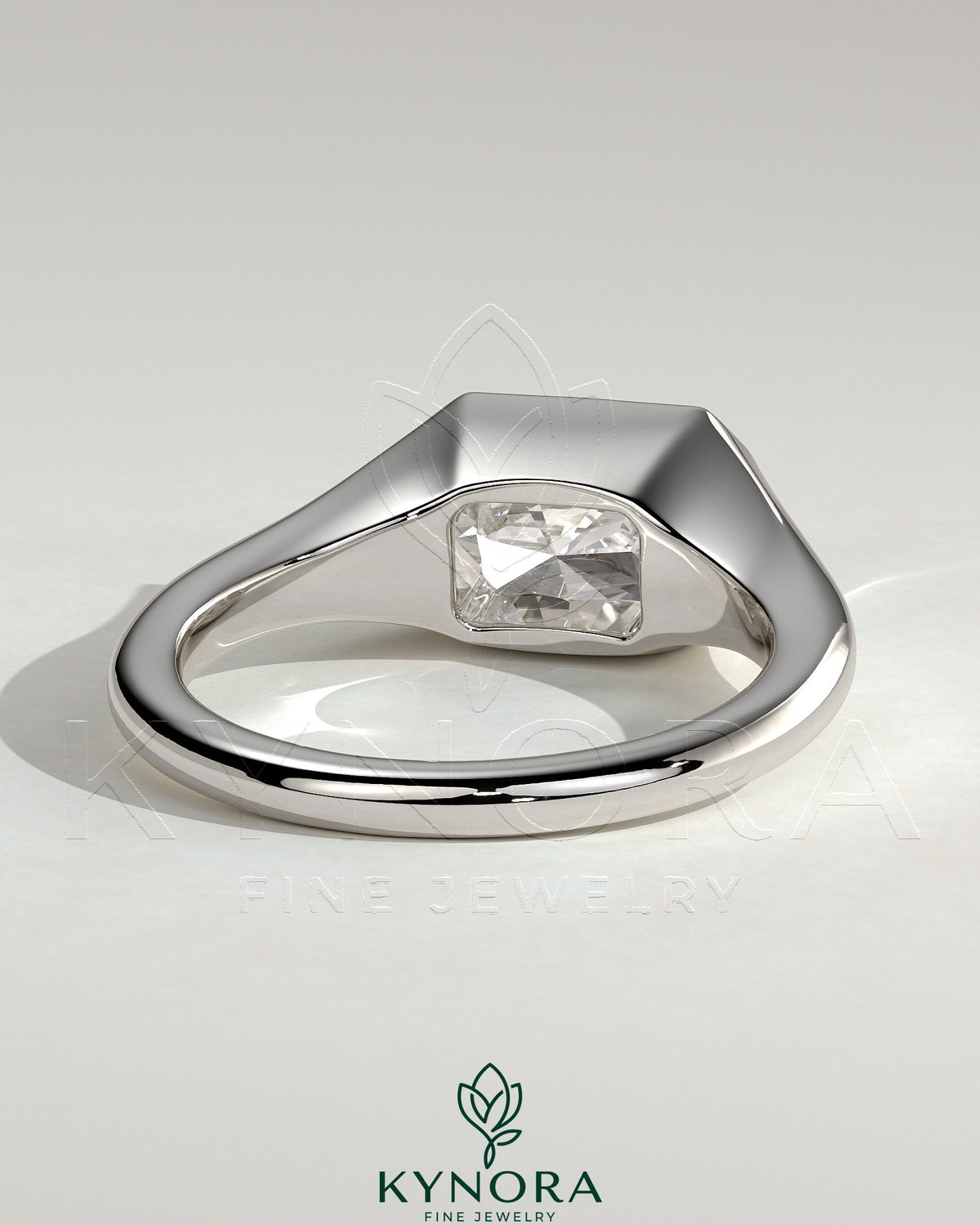 Kynora CJ Radiant East-West Bezel Solitaire engagement ring with signet band, featuring a radiant-cut gemstone in a sleek, elegant setting