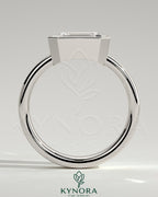 Kynora CJ East-West 2ct emerald bezel solitaire engagement ring with flat cigar band, showcasing a vibrant emerald gemstone and elegant design.