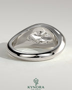 Kynora CJ statement 2ct marquise east-west bezel solitaire engagement ring with signet band, featuring a prominent marquise diamond.