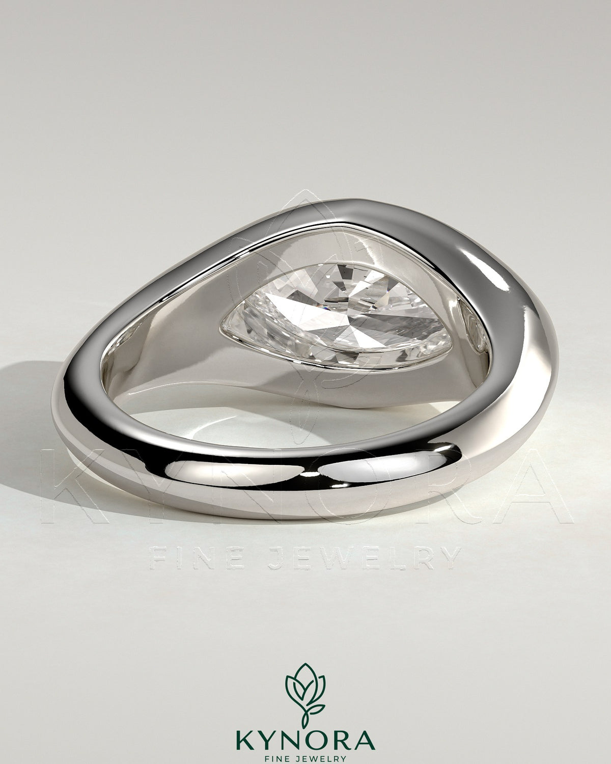 Kynora CJ statement 2ct marquise east-west bezel solitaire engagement ring with signet band, featuring a prominent marquise diamond.