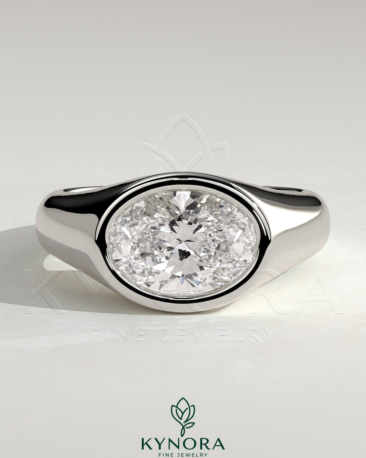 Kynora CJ statement 2ct oval east-west bezel solitaire engagement ring with signet band, featuring a prominent oval diamond.