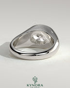 Kynora CJ statement 2ct oval east-west bezel solitaire engagement ring with signet band, featuring a prominent oval diamond.