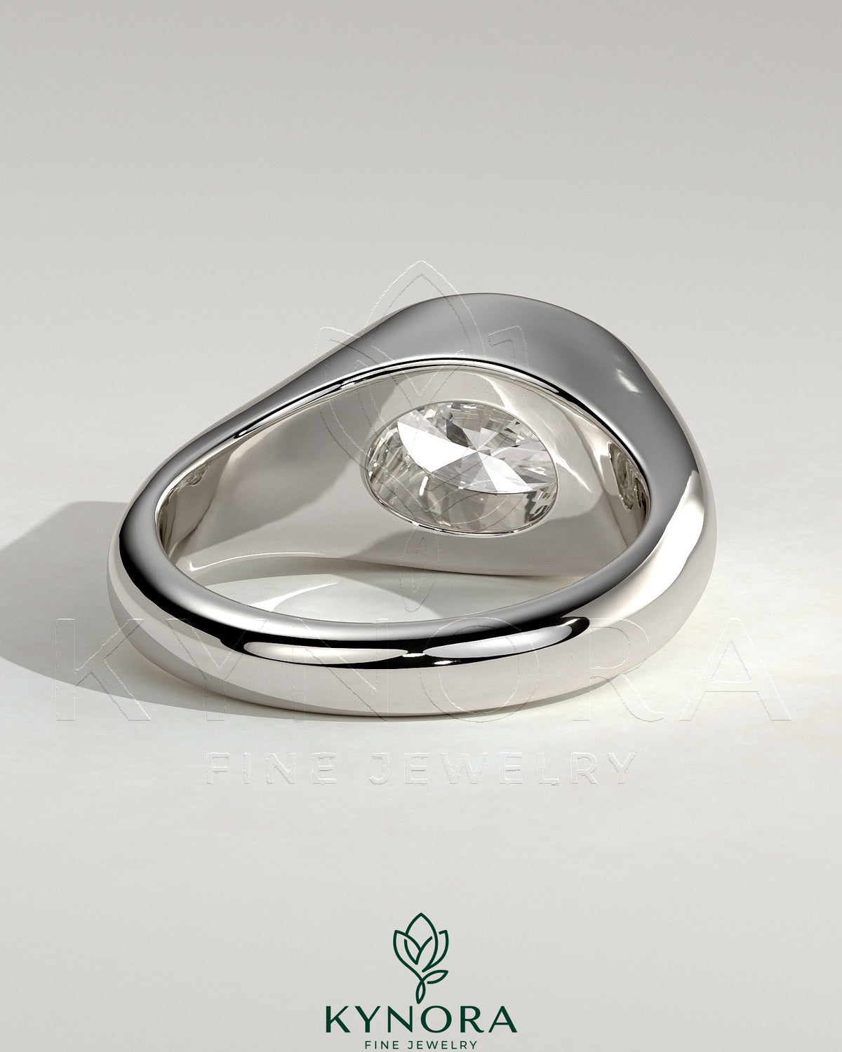 Kynora CJ statement 2ct oval east-west bezel solitaire engagement ring with signet band, featuring a prominent oval diamond.