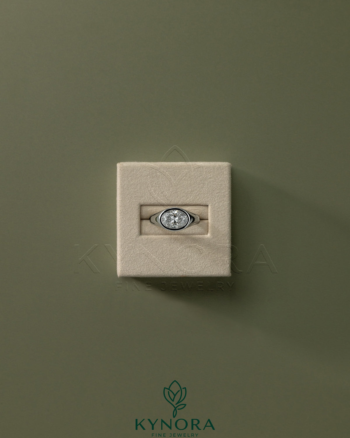 Kynora CJ statement 2ct oval east-west bezel solitaire engagement ring with signet band showcasing a prominent oval diamond.